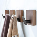 DELITON Adhesive Towel Hooks,Wall Hooks for bathrooms Without Drilling, Wood Wall Hooks for Hanging Robe, Towel, Bag Stick on Farmhouse Bathroom Bedroom Entryway 4 Packs Burned Brown